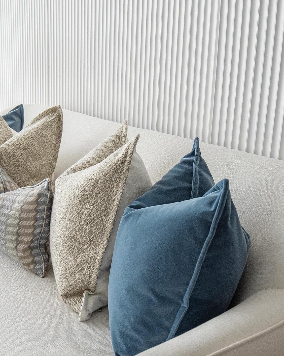 Stephan Bundle cushion in silver, blue and beige, shown in a lifestyle right view as image 5