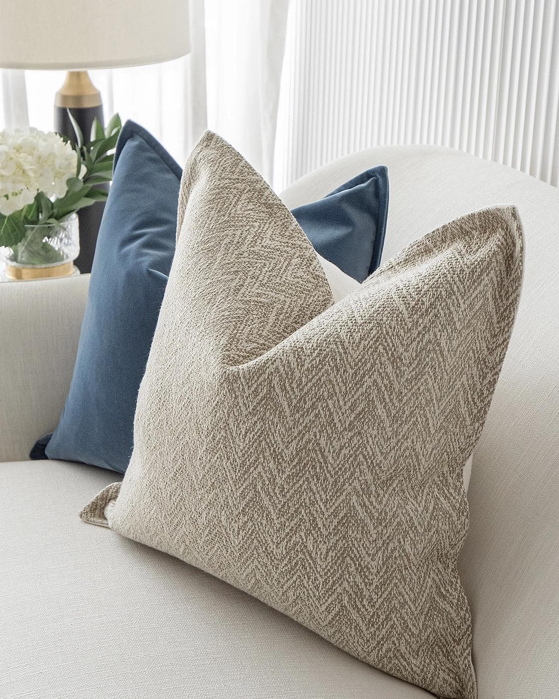 Stephan Bundle cushion in silver, blue and beige, shown in a lifestyle right view as image 6
