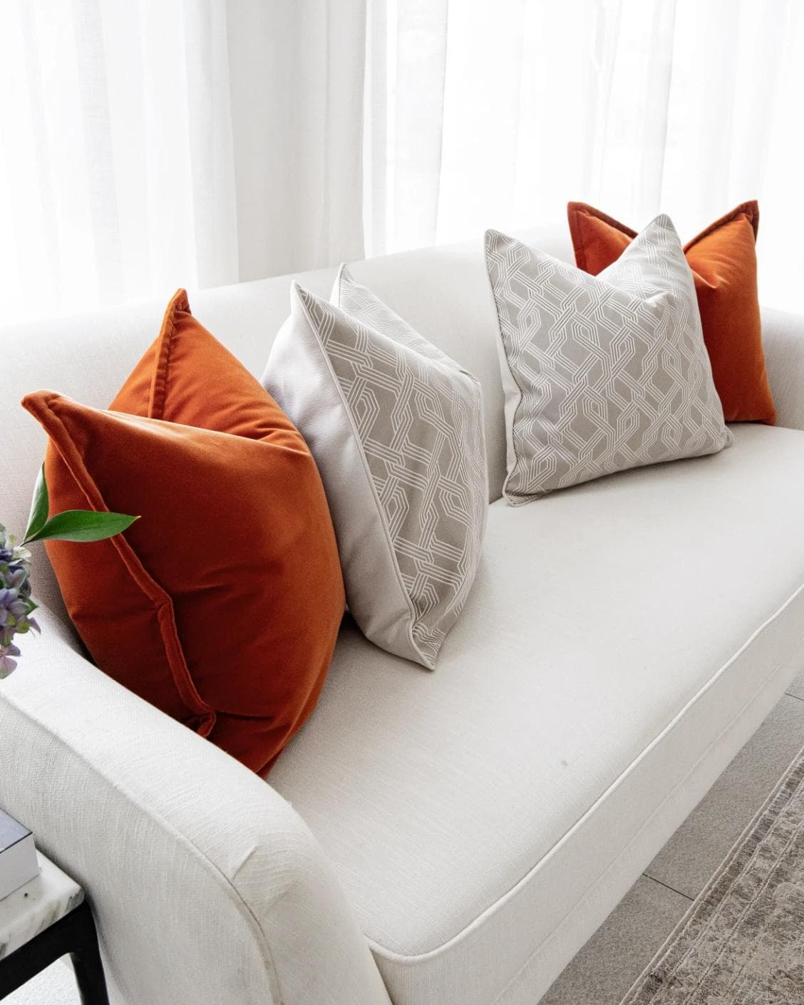 Marites Bundle cushion in tan, orange, beige and white, shown in a product left view as image 6
