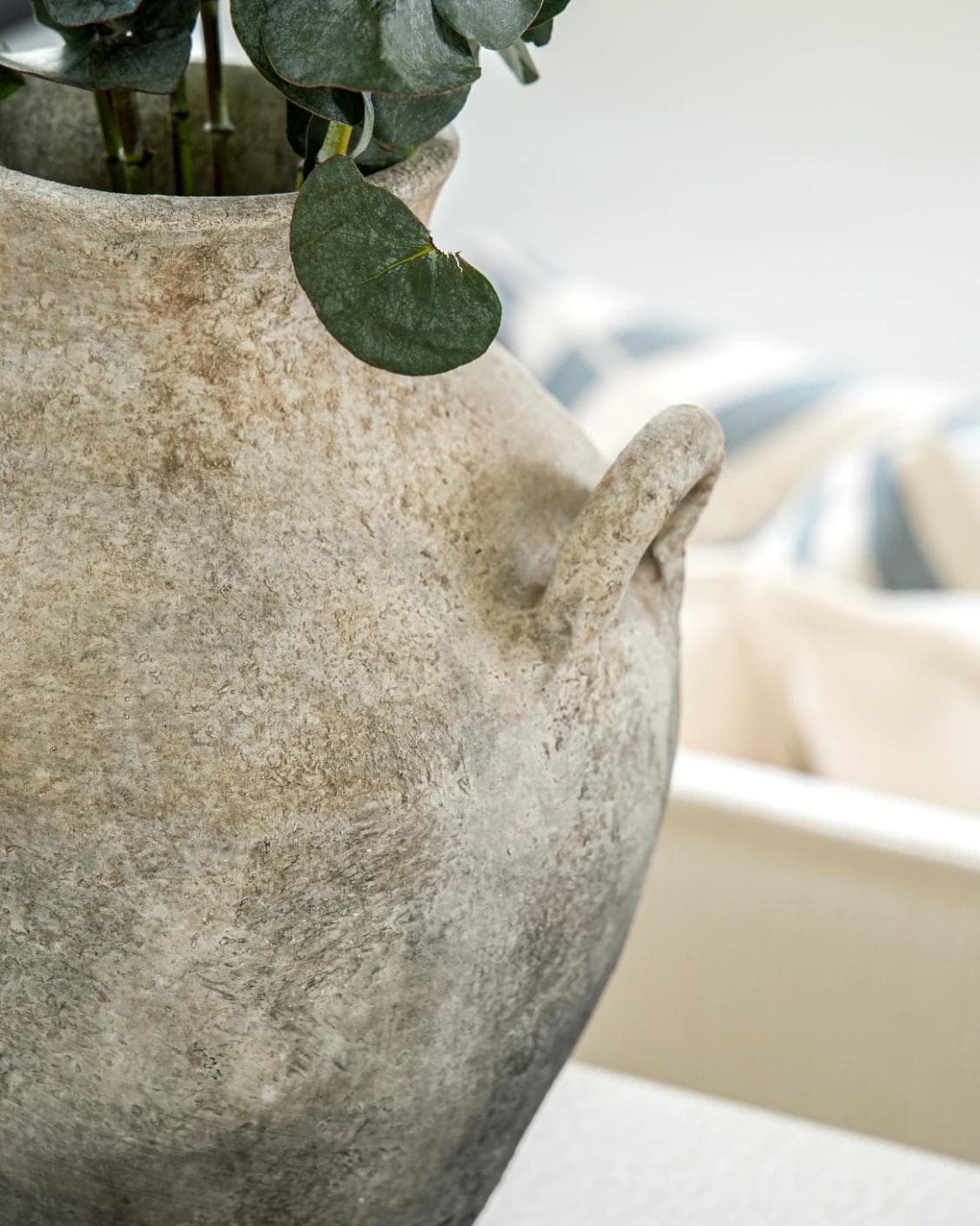 Vess Terra vases in stone and grey, shown in a lifestyle close-up as image 4