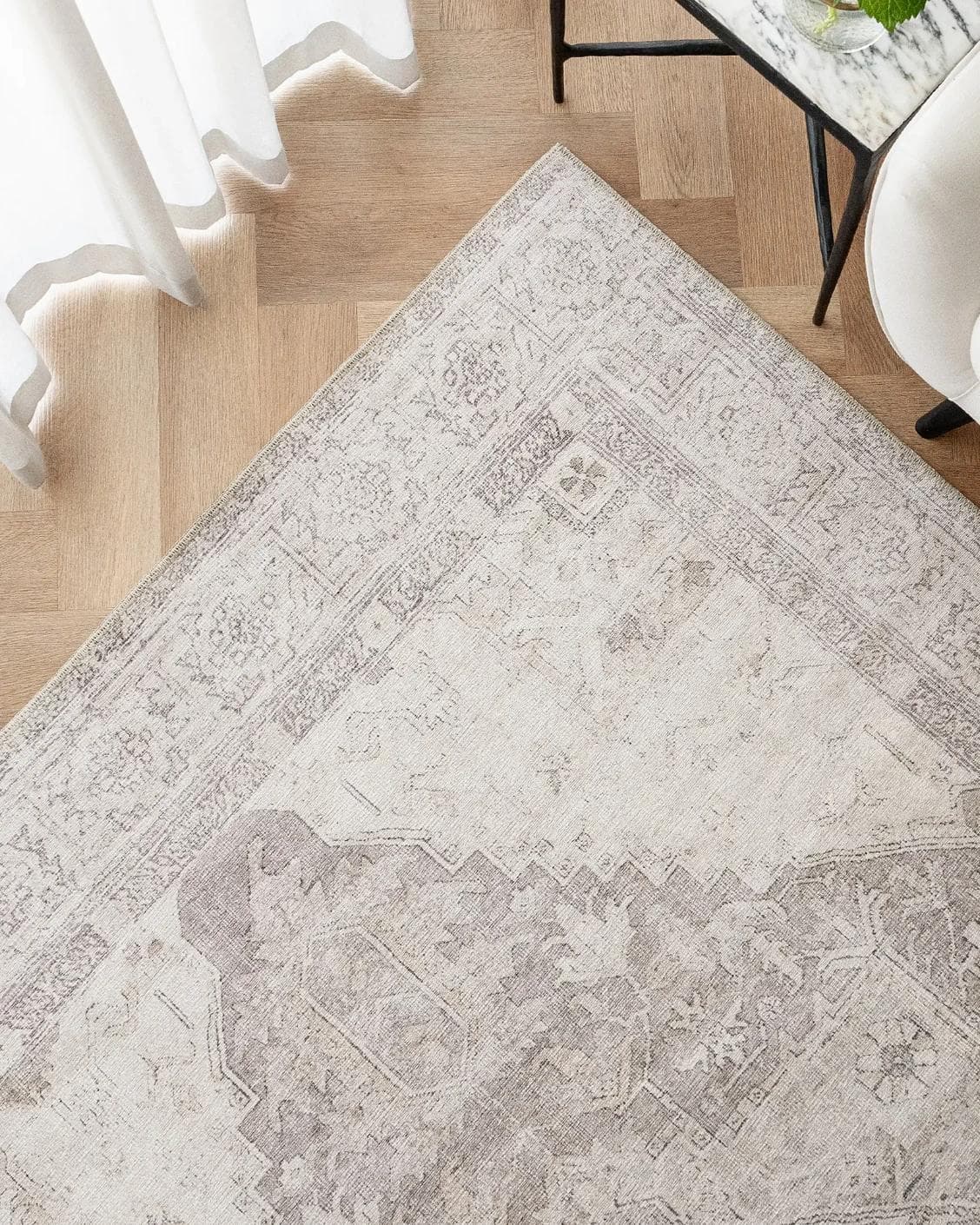 Vince Clay carpet in beige and grey, shown in a lifestyle top view as image 2