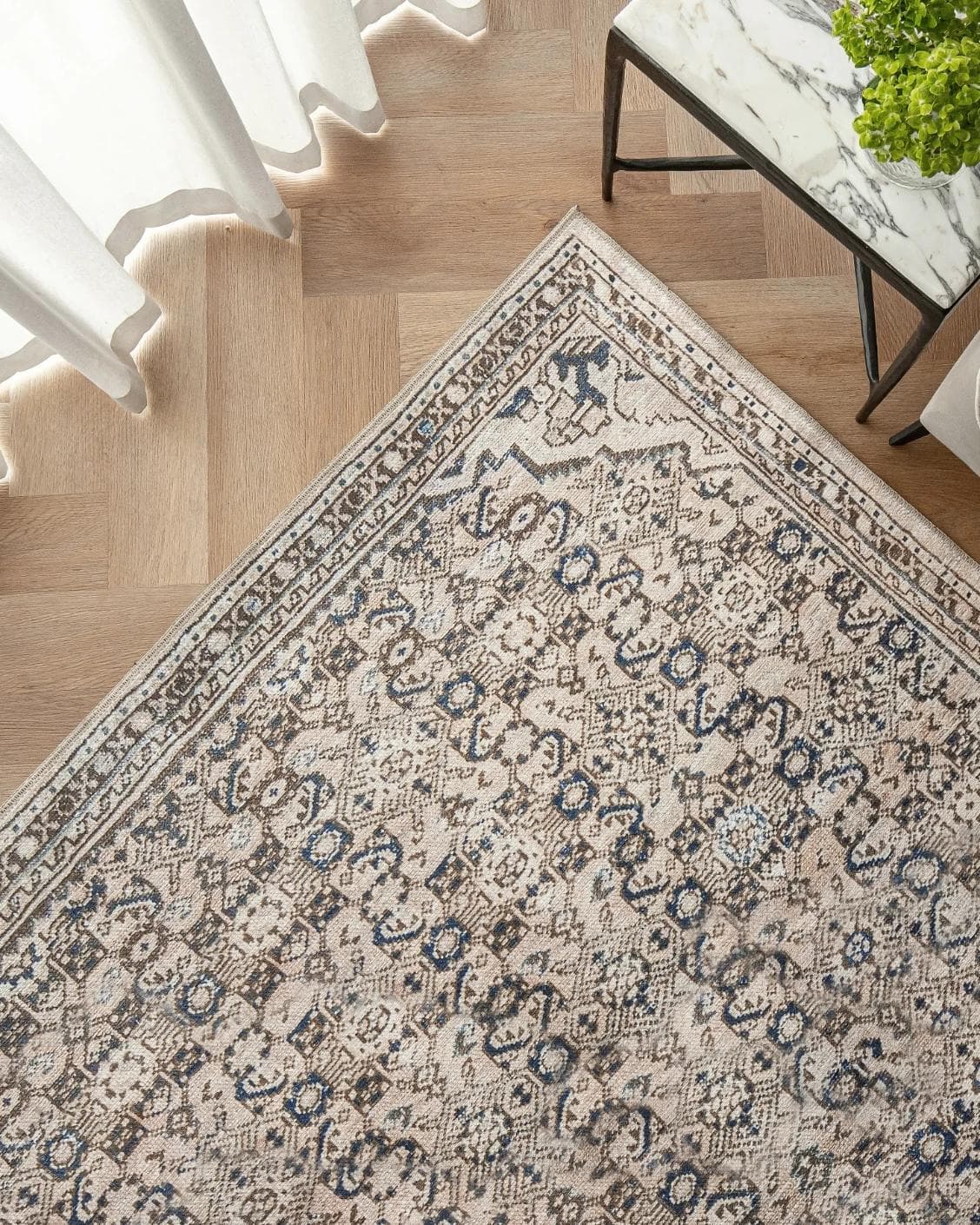 Vince Dune carpet in brown and beige, shown in a lifestyle top view as image 2