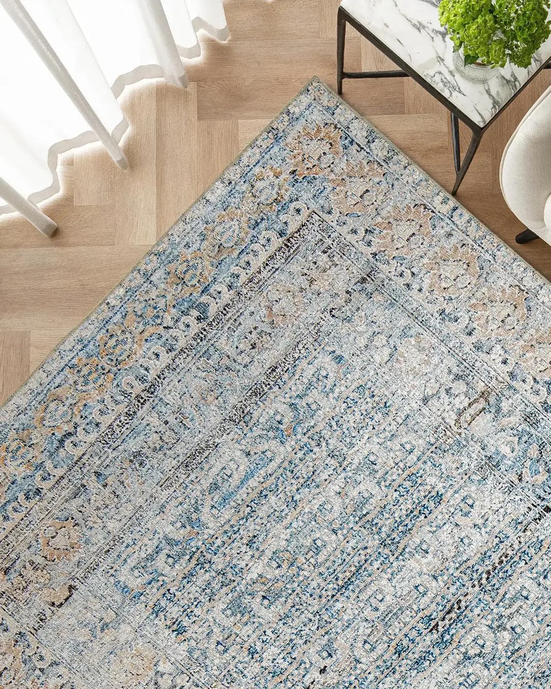 Vince Lake carpet in blue and rust, shown in a lifestyle top view as image 2