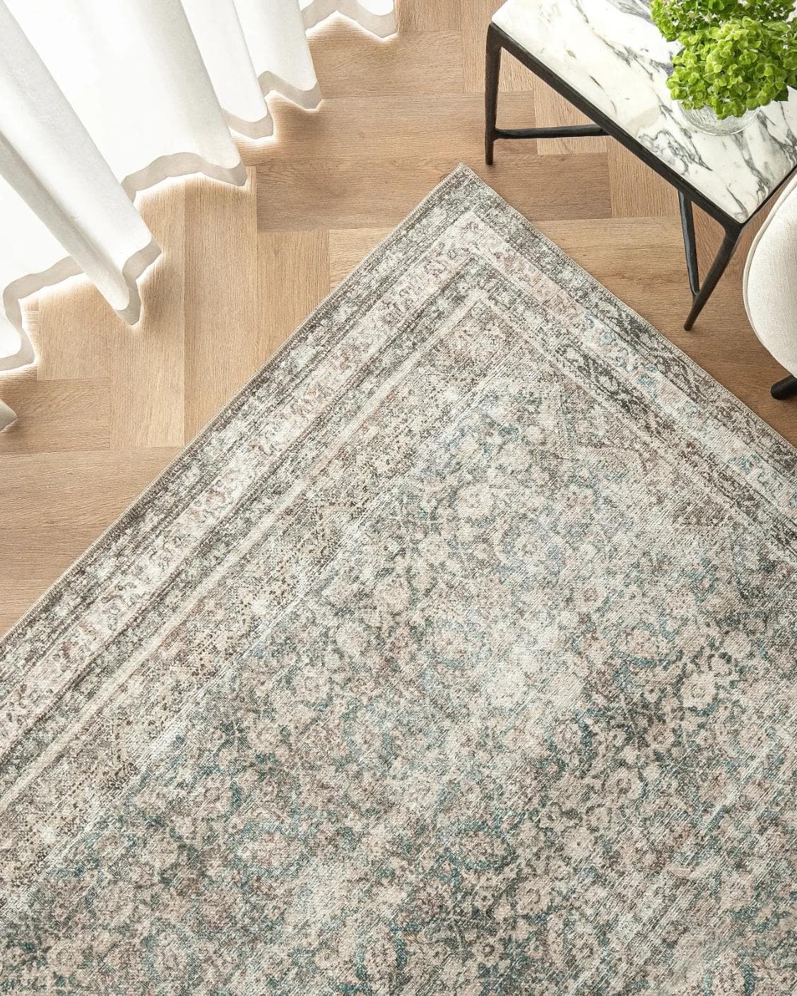 Vince Mira carpet in grey, shown in a lifestyle top view as image 2