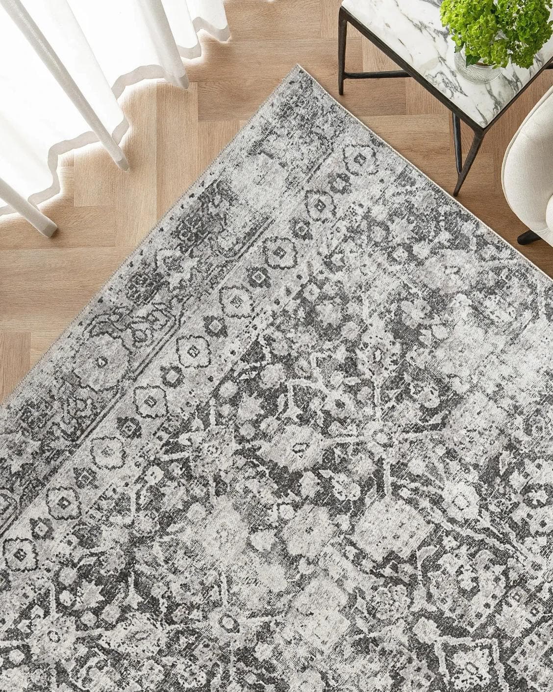 Vince Porcini carpet in grey and charcoal, shown in a lifestyle top view as image 2