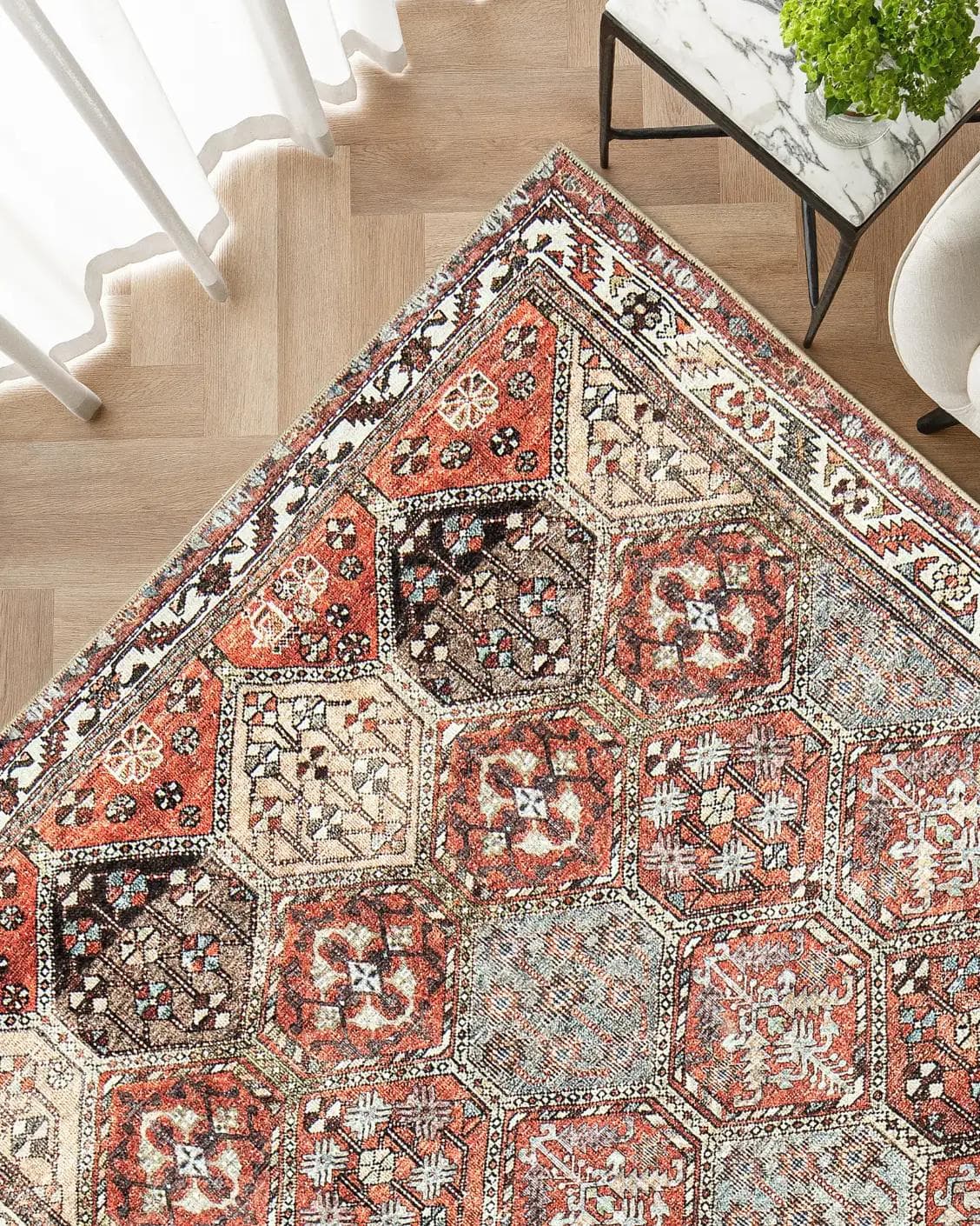 Vince Rosso carpet in rust and multicolour, shown in a lifestyle top view as image 2