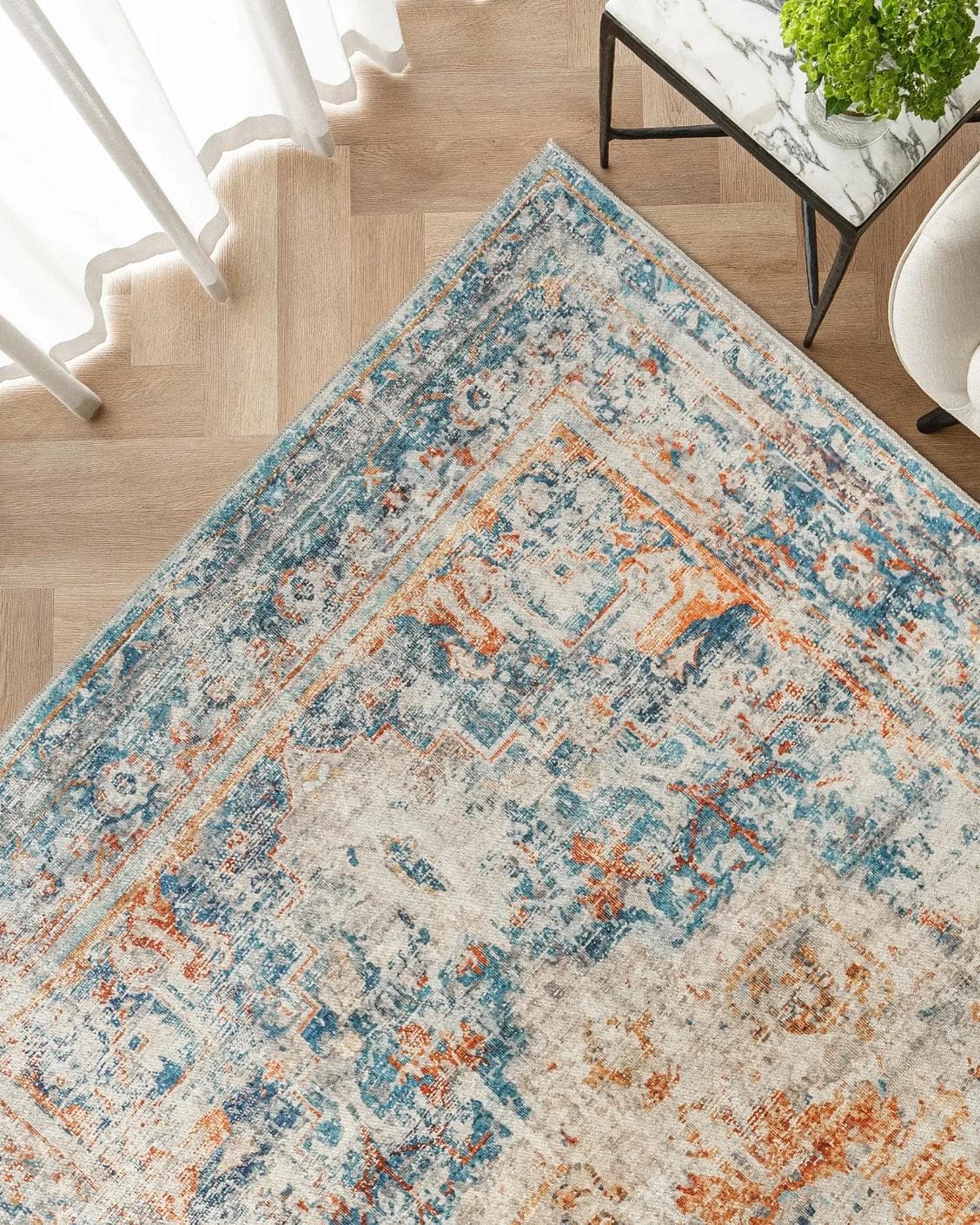 Vince Tangelo carpet in beige, blue, orange and multicolour, shown in a lifestyle top view as image 2