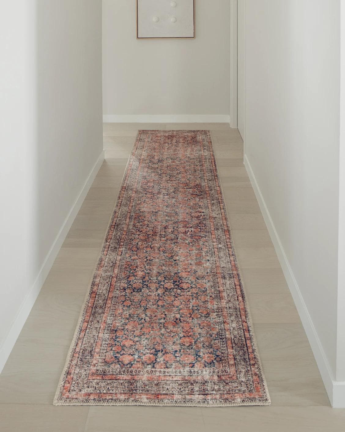 Vincent Terracotta Runners carpet in rust and multicolour, shown in a lifestyle front view