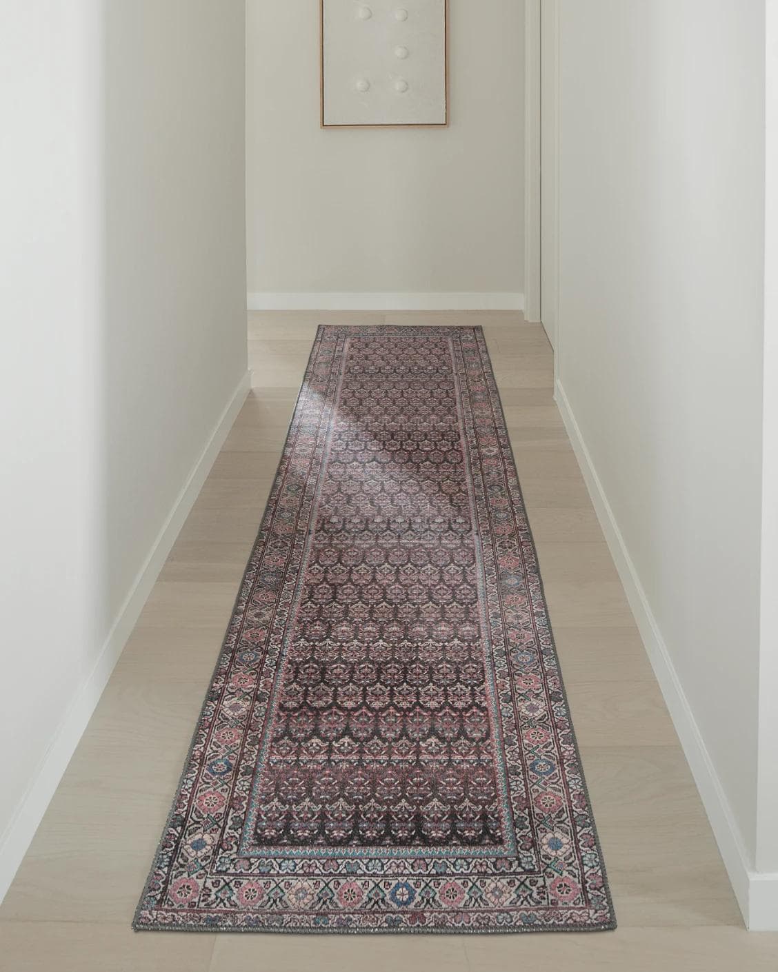 Vincent Umber Runners carpet in red, blue and multicolour, shown in a lifestyle front view