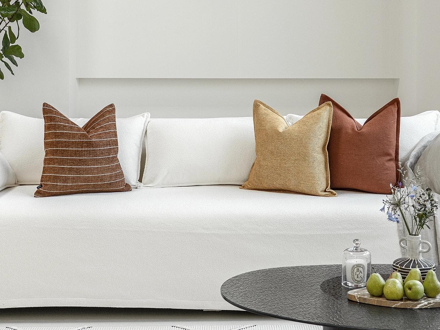 Vixi Bundle cushion in dune, brown and rust, shown in a lifestyle front view as image 4
