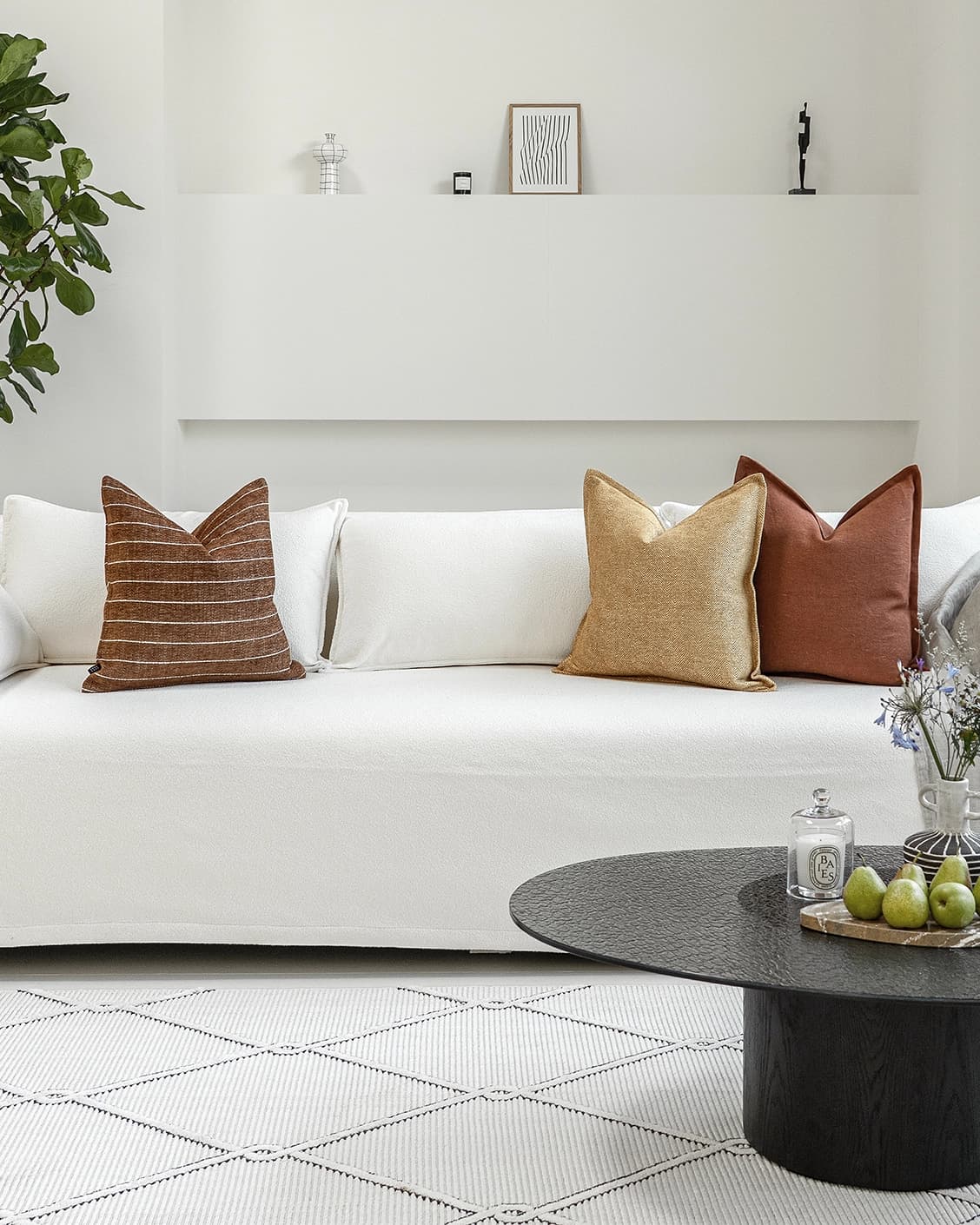 Vixi Bundle cushion in dune, brown and rust, shown in a lifestyle front view as image 4