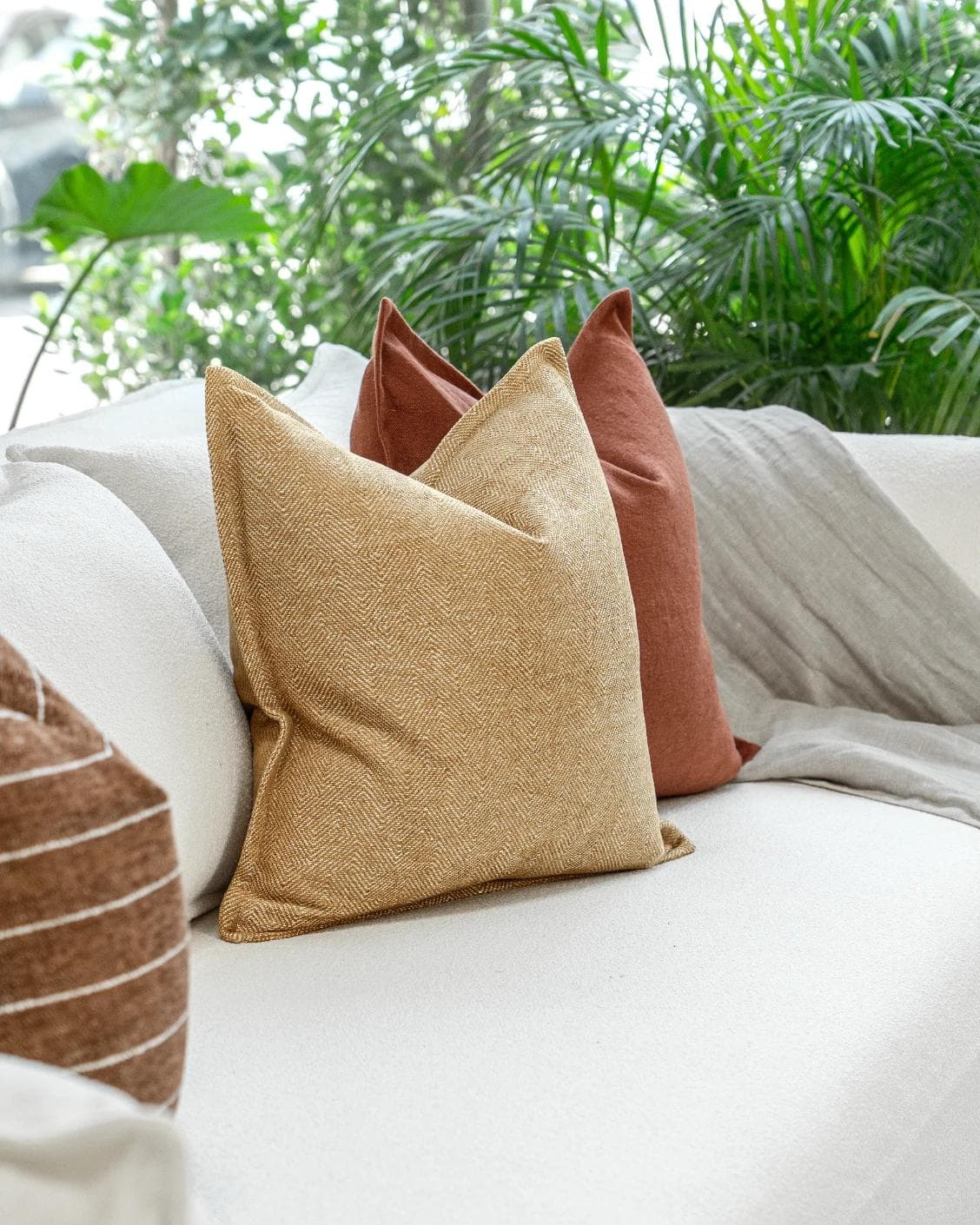 Vixi Bundle cushion in dune, brown and rust, shown in a product left view as image 6