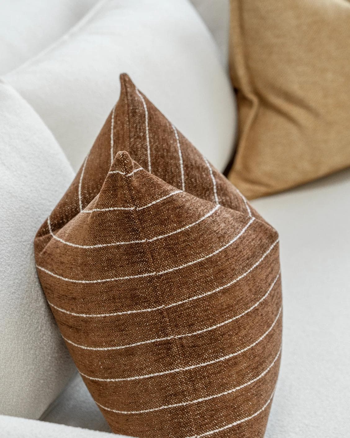 Vixi Bundle cushion in dune, brown and rust, shown in a product left view as image 7