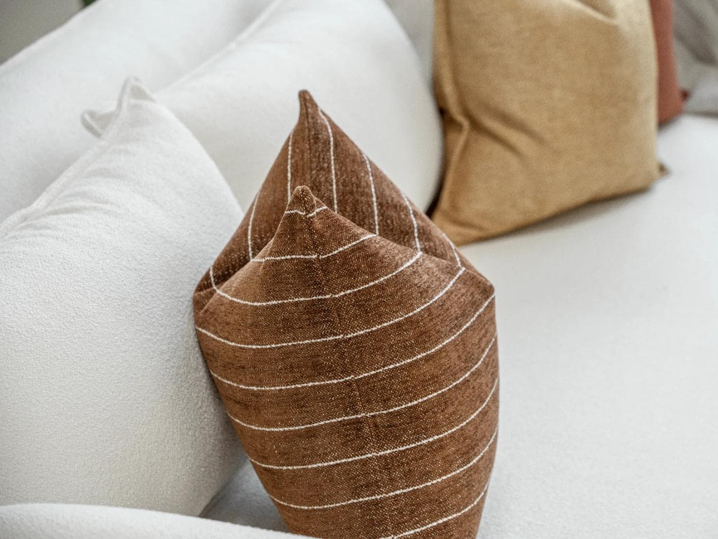 Vixi Bundle cushion in dune, brown and rust, shown in a product left view as image 7