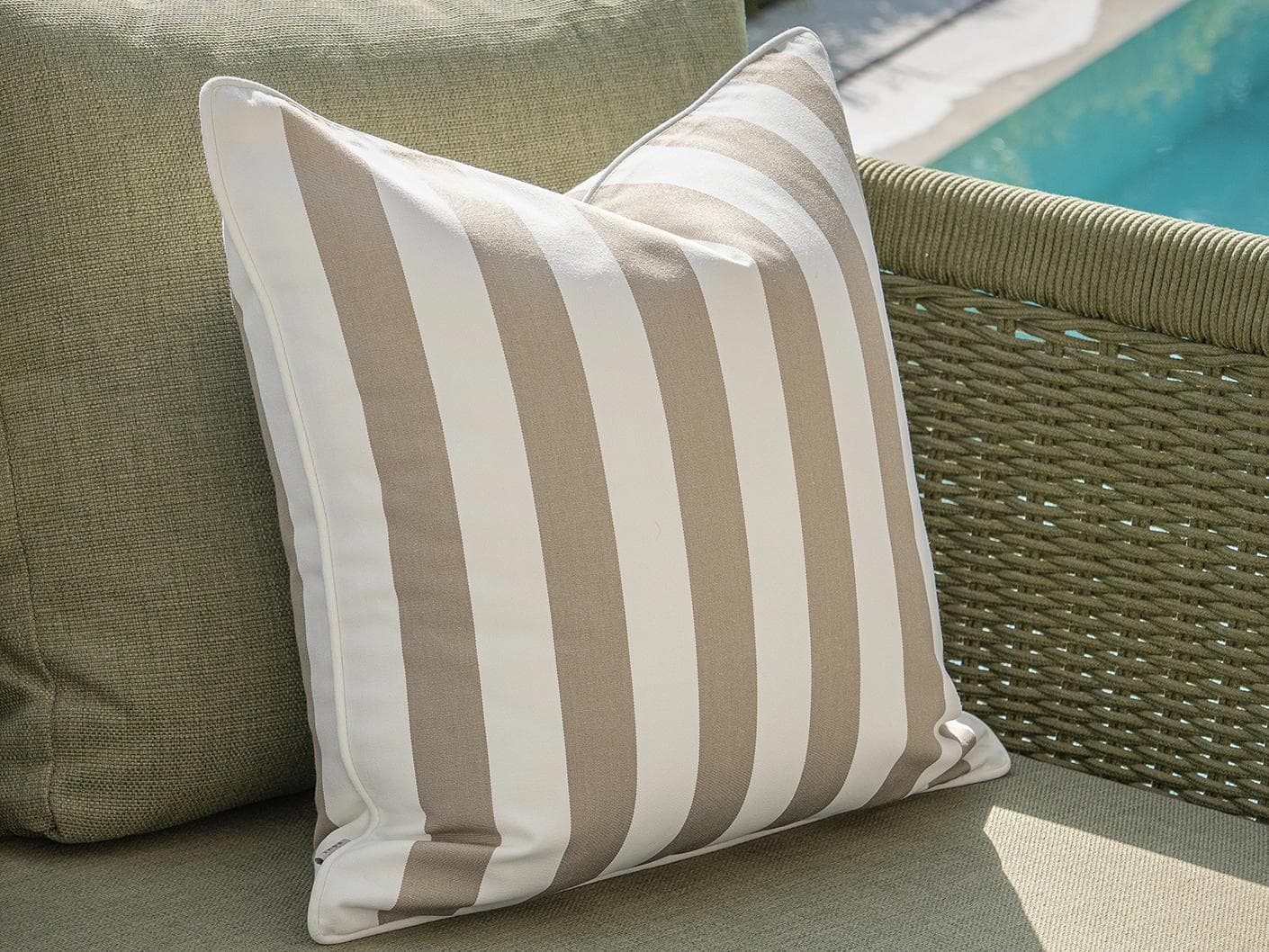 Vrithi Bundle cushion in beige, shown in a lifestyle left view as image 6