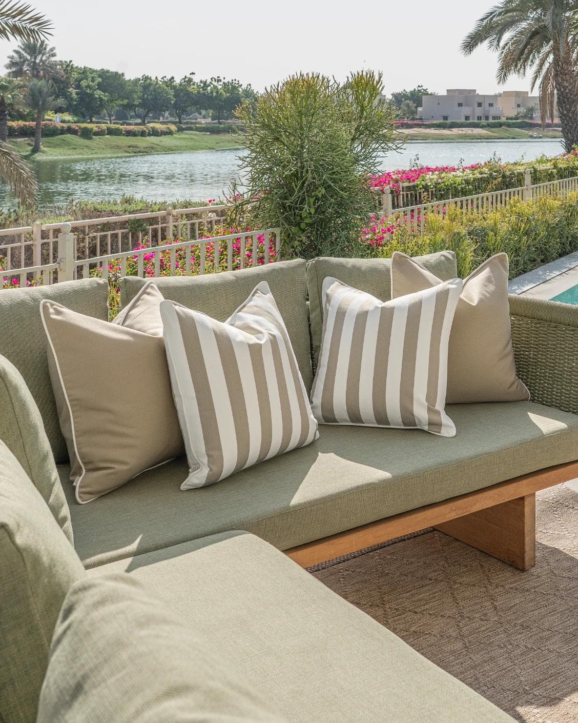 Vrithi Bundle cushion in beige, shown in a lifestyle left view as image 2