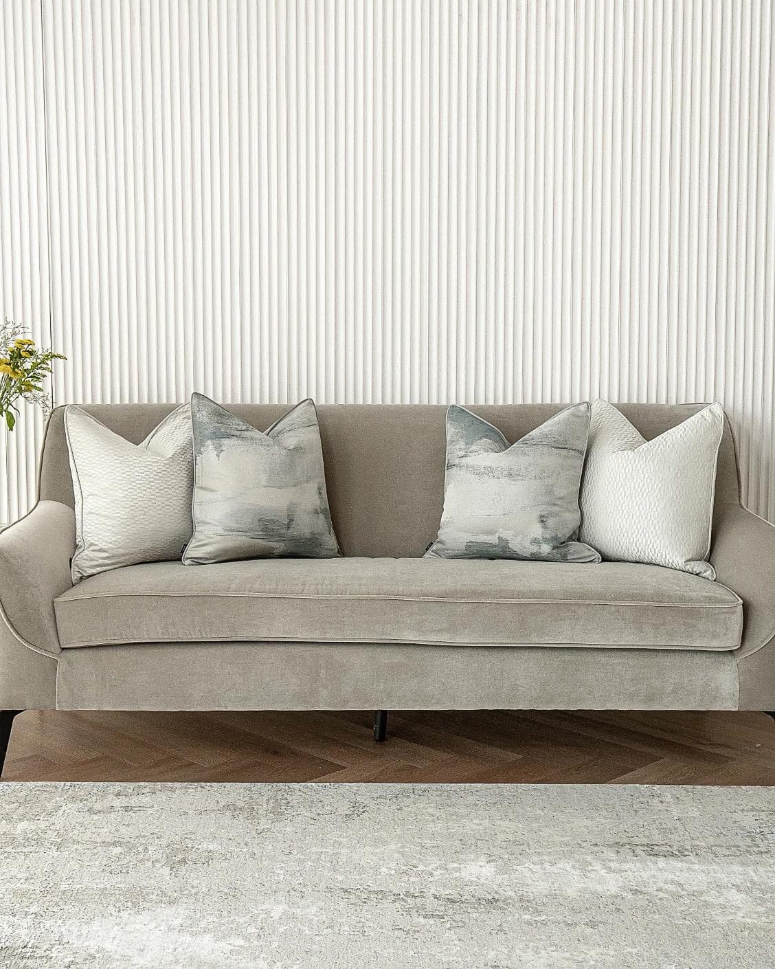 Carey Bundle cushion in blue and silver, shown in a lifestyle front view as image 4