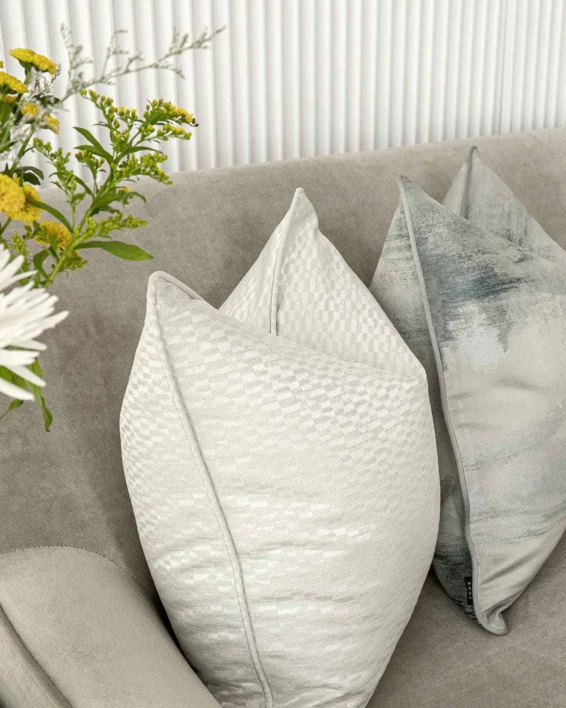 Carey Bundle cushion in blue and silver, shown in a lifestyle left view as image 5
