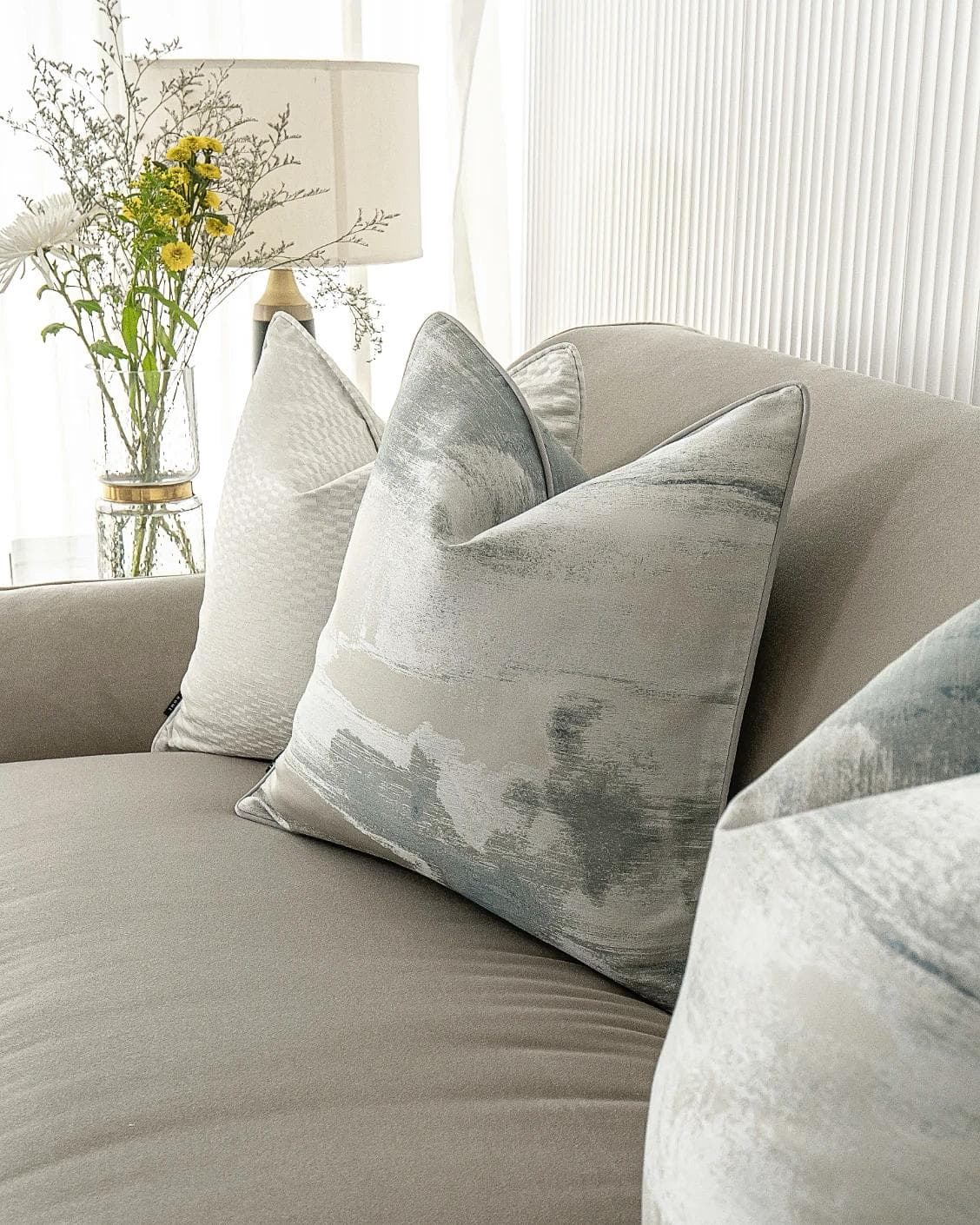 Carey Bundle cushion in blue and silver, shown in a lifestyle right view as image 6