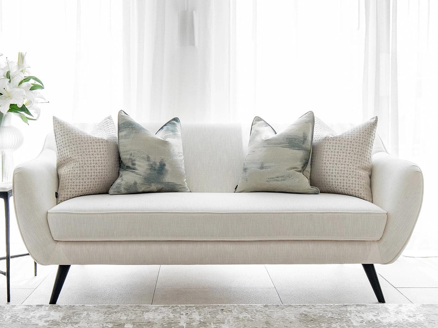 Orlan Bundle cushion in blue, silver and white, shown in a lifestyle front view as image 4