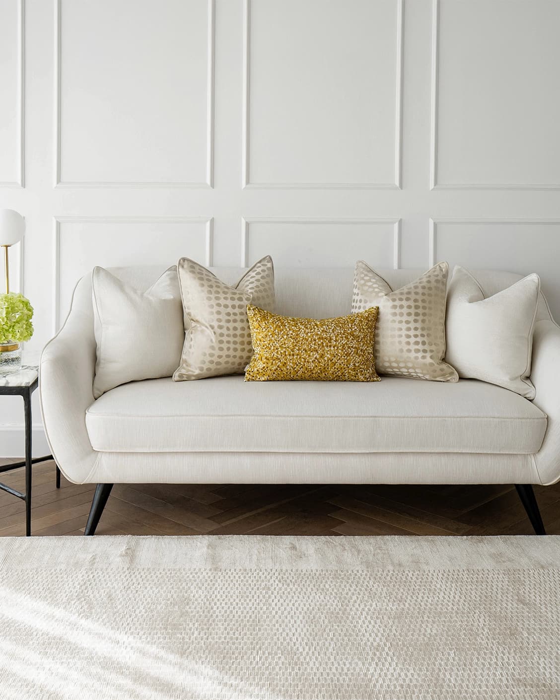Valentina Bundle cushion in white, gold, yellow and beige, shown in a lifestyle front view as image 4