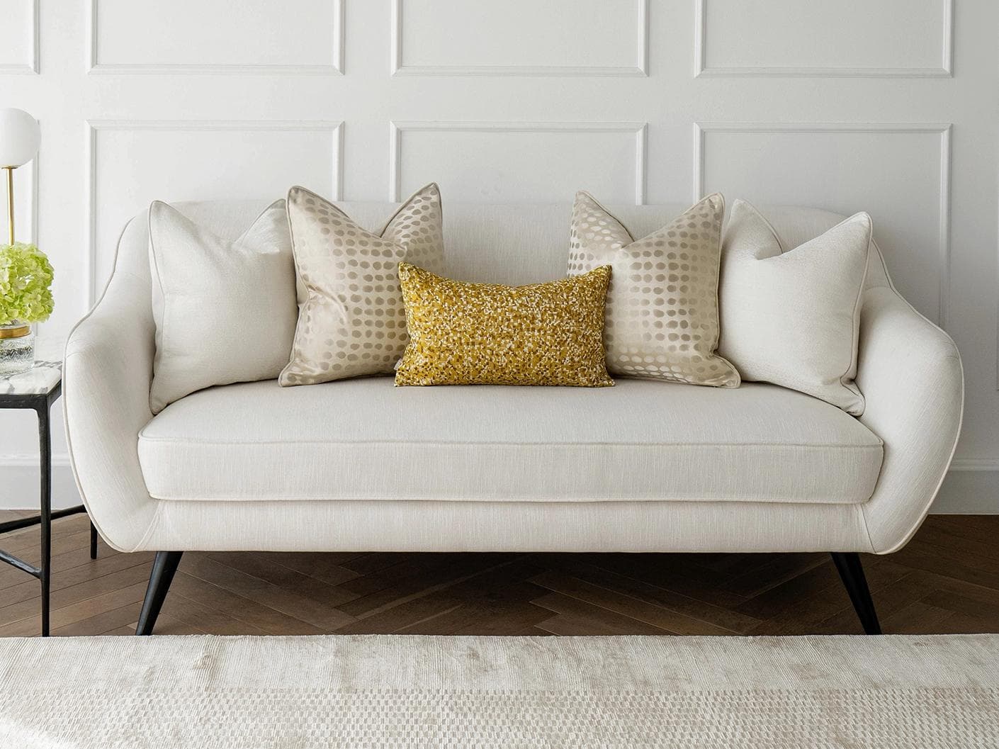 Valentina Bundle cushion in white, gold, yellow and beige, shown in a lifestyle front view as image 4