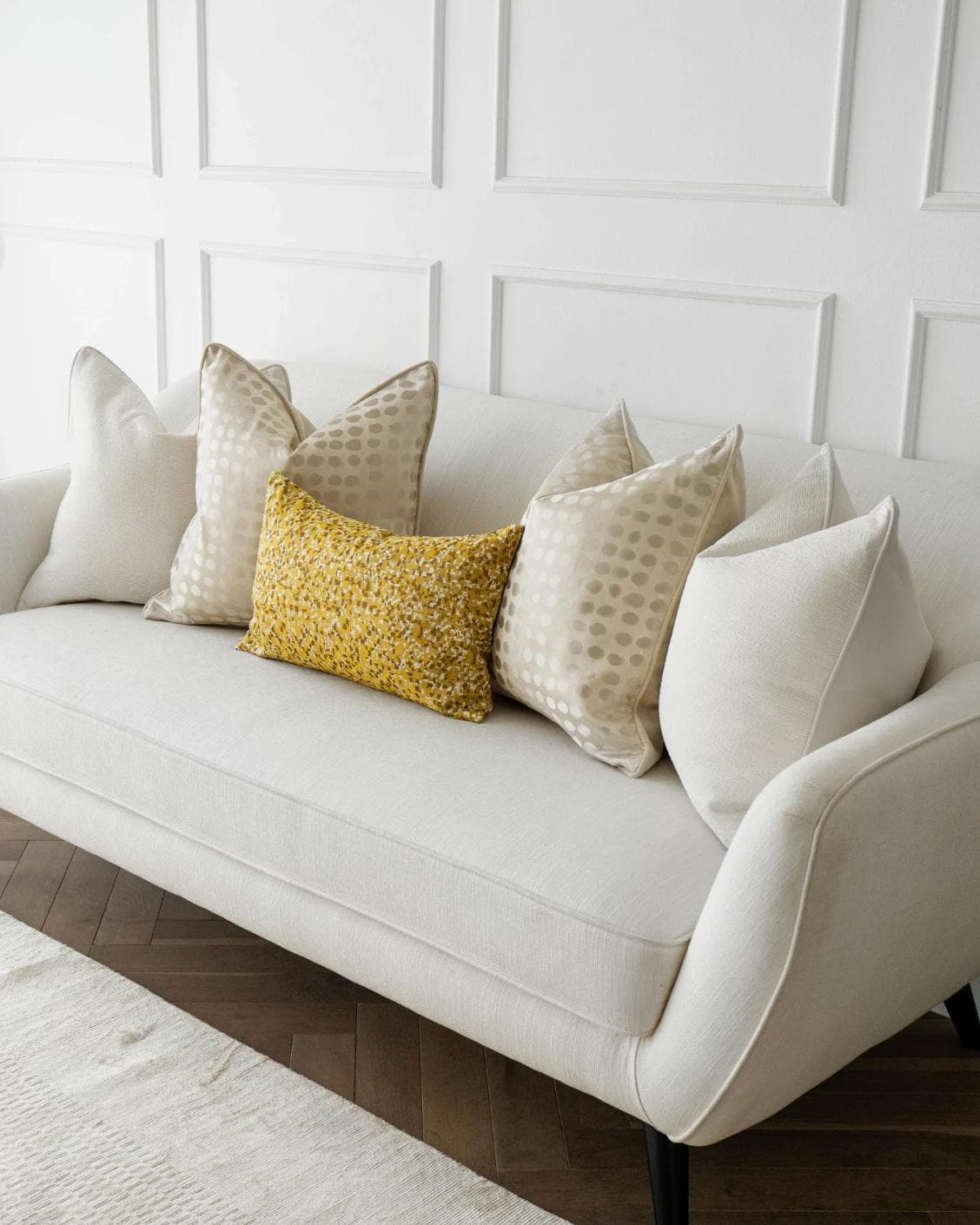 Valentina Bundle cushion in white, gold, yellow and beige, shown in a lifestyle right view as image 2
