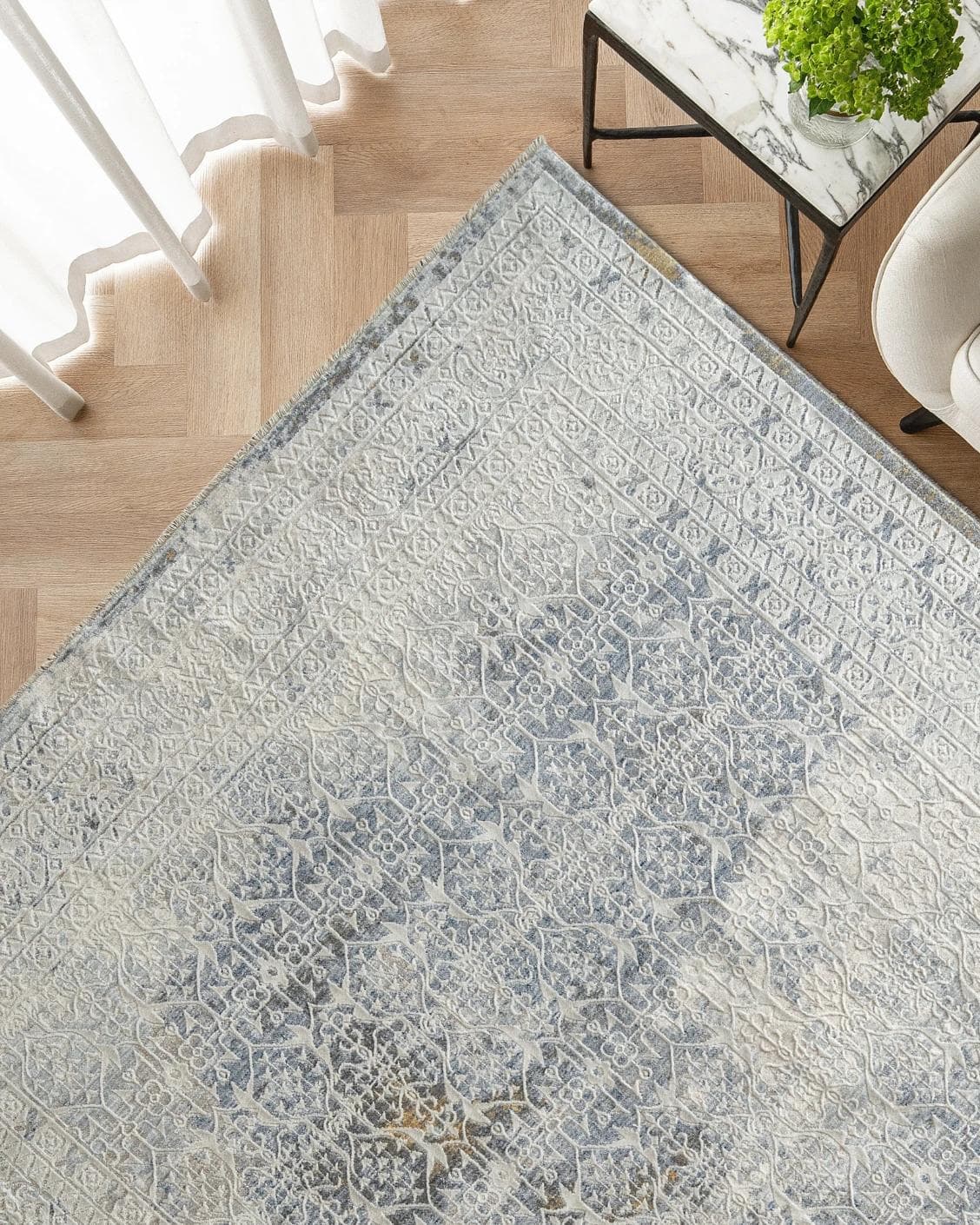 William Sandy carpet in beige, yellow and grey, shown in a lifestyle top view as image 2