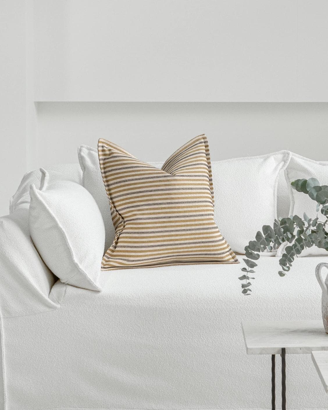 Wren Laurent cushion in ivory and multicolour, shown in a lifestyle front view as image 4