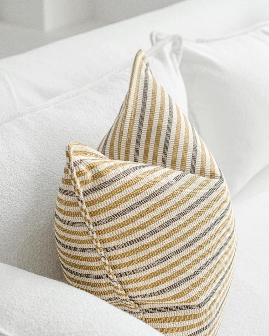 Wren Laurent cushion in ivory and multicolour, shown in a lifestyle top view as image 5