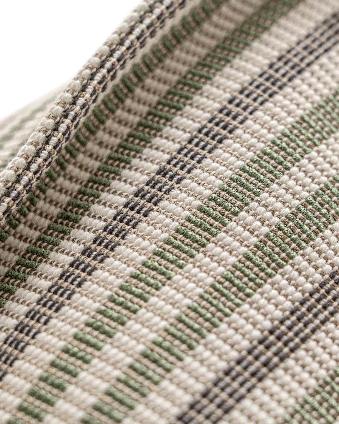 Wren Pistachio cushion in green and ivory, shown in a product close-up as image 6