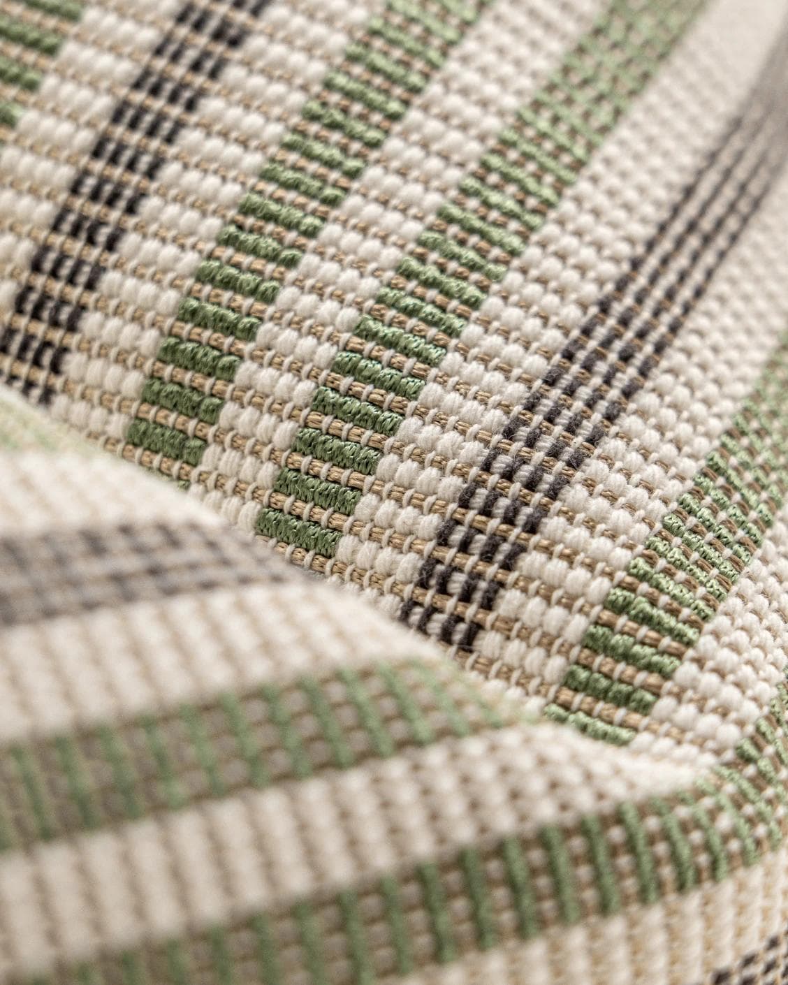 Wren Pistachio cushion in green and ivory, shown in a product close-up as image 7
