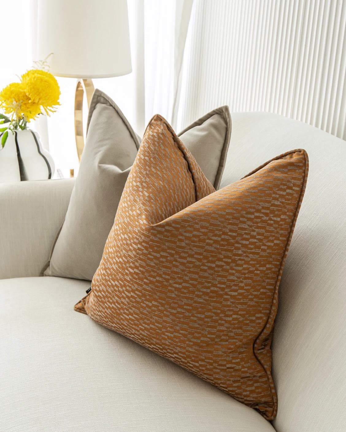 Yabella Bundle cushion in grey and orange, shown in a lifestyle right view as image 6