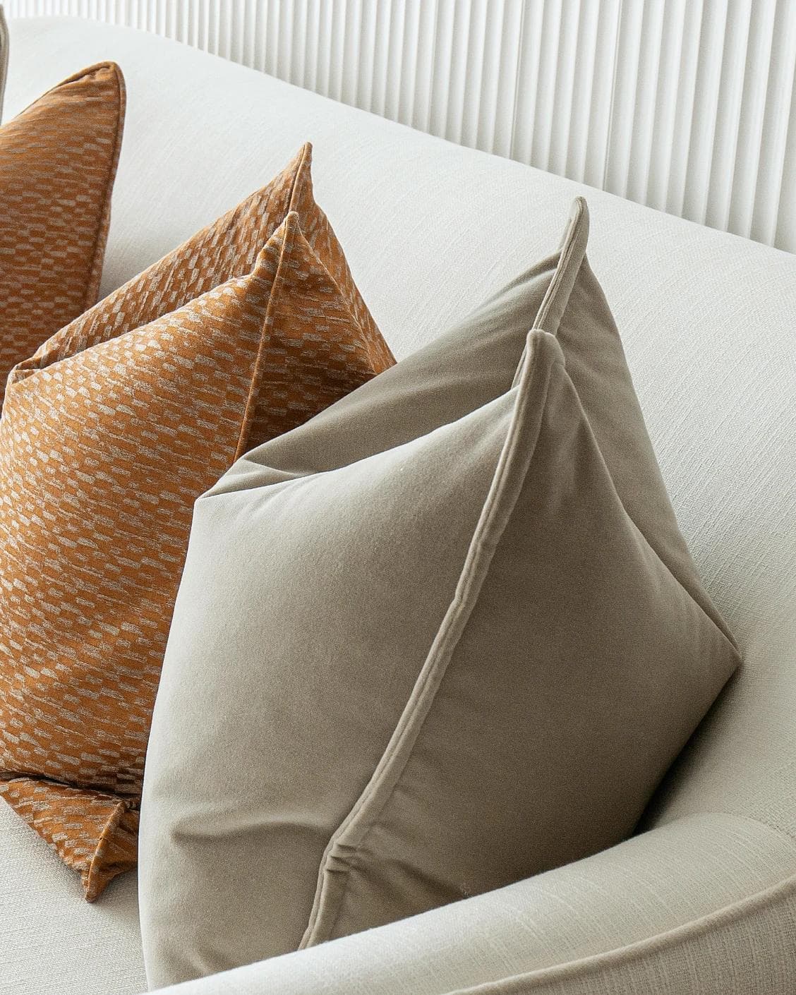 Yabella Bundle cushion in grey and orange, shown in a product right view as image 8