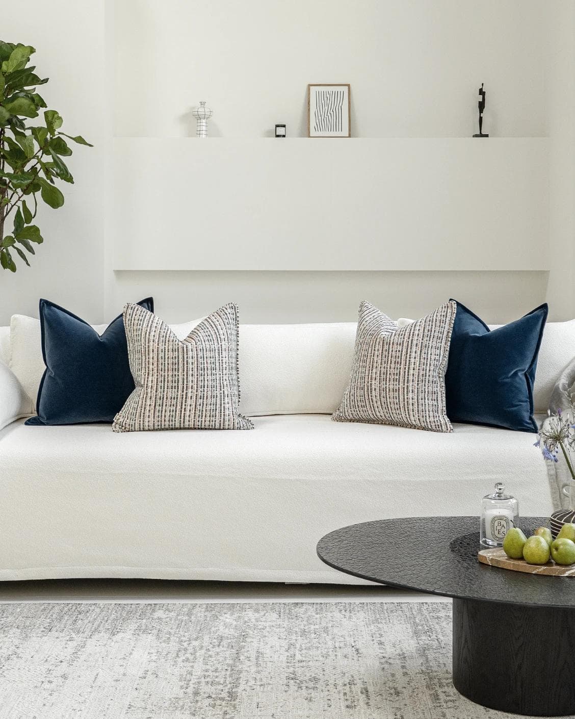 Yakshith Bundle cushion in blue and cream, shown in a lifestyle front view as image 4