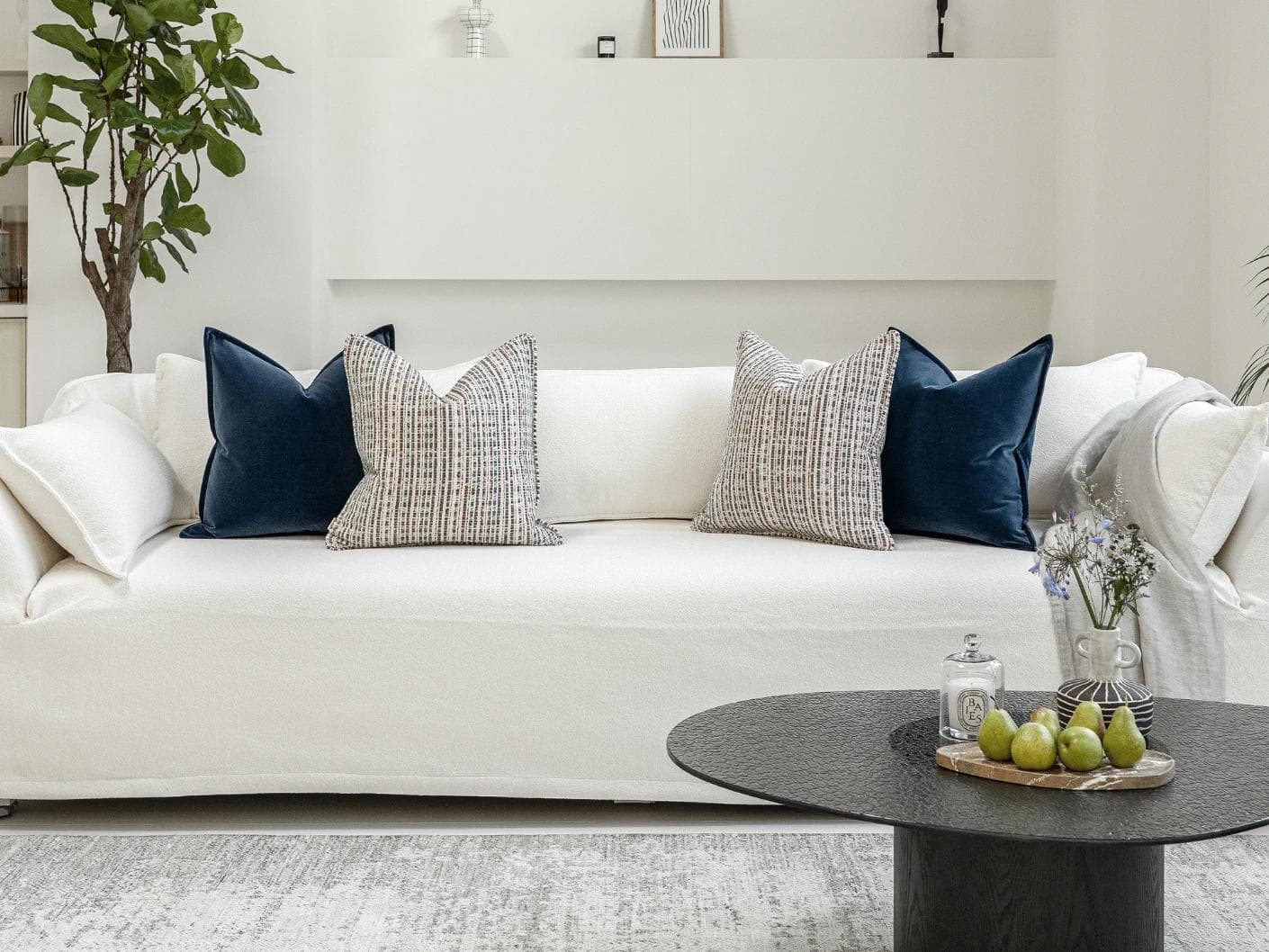 Yakshith Bundle cushion in blue and cream, shown in a lifestyle front view as image 4
