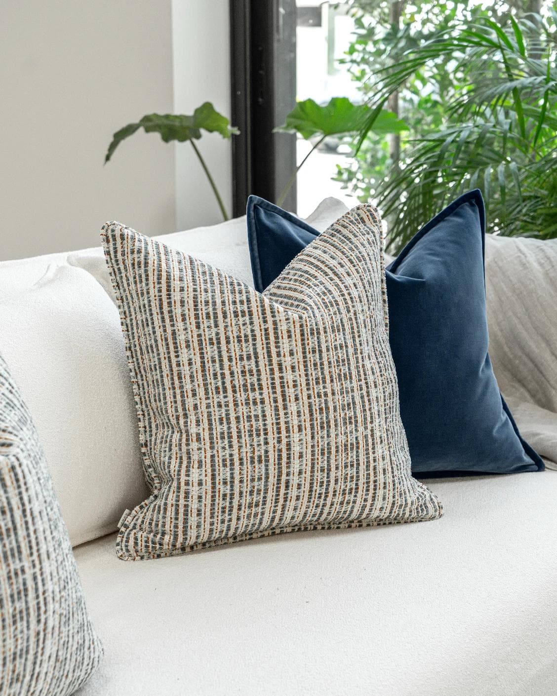 Yakshith Bundle cushion in blue and cream, shown in a product left view as image 5