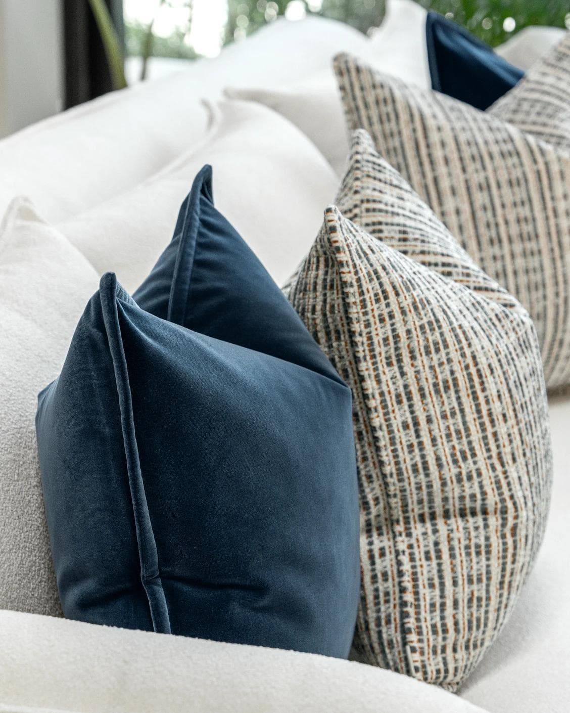 Yakshith Bundle cushion in blue and cream, shown in a product left view as image 6