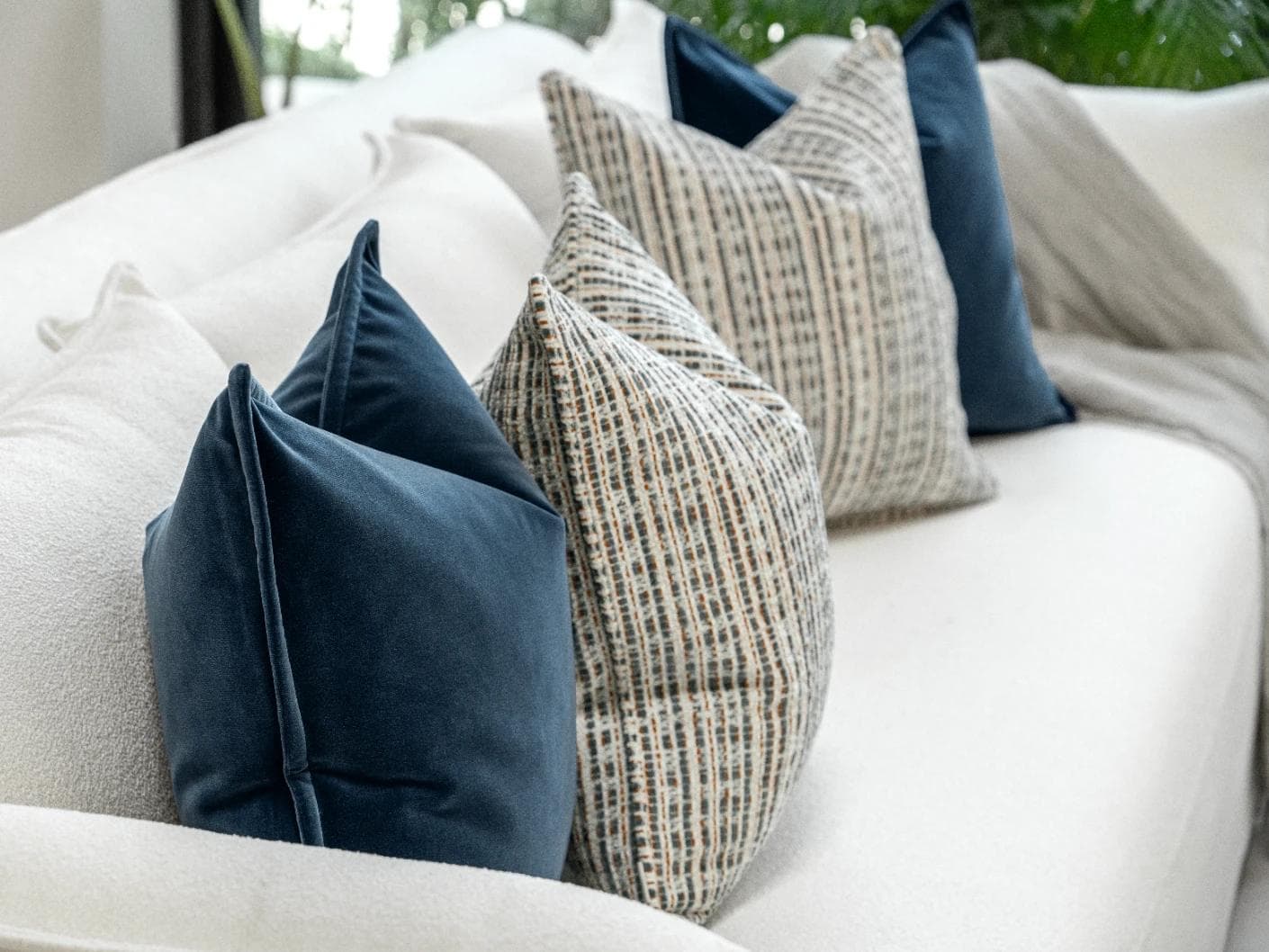 Yakshith Bundle cushion in blue and cream, shown in a product left view as image 6