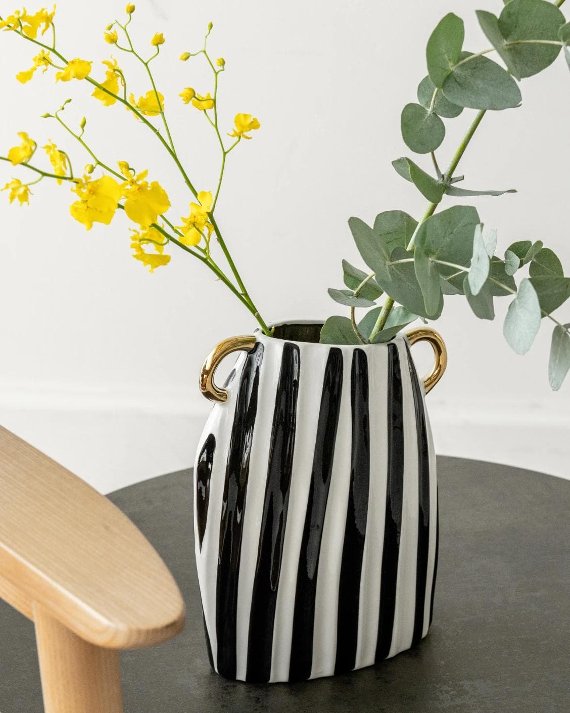 Yara Arneson vases in gold, black and white, shown in a lifestyle left view as image 5