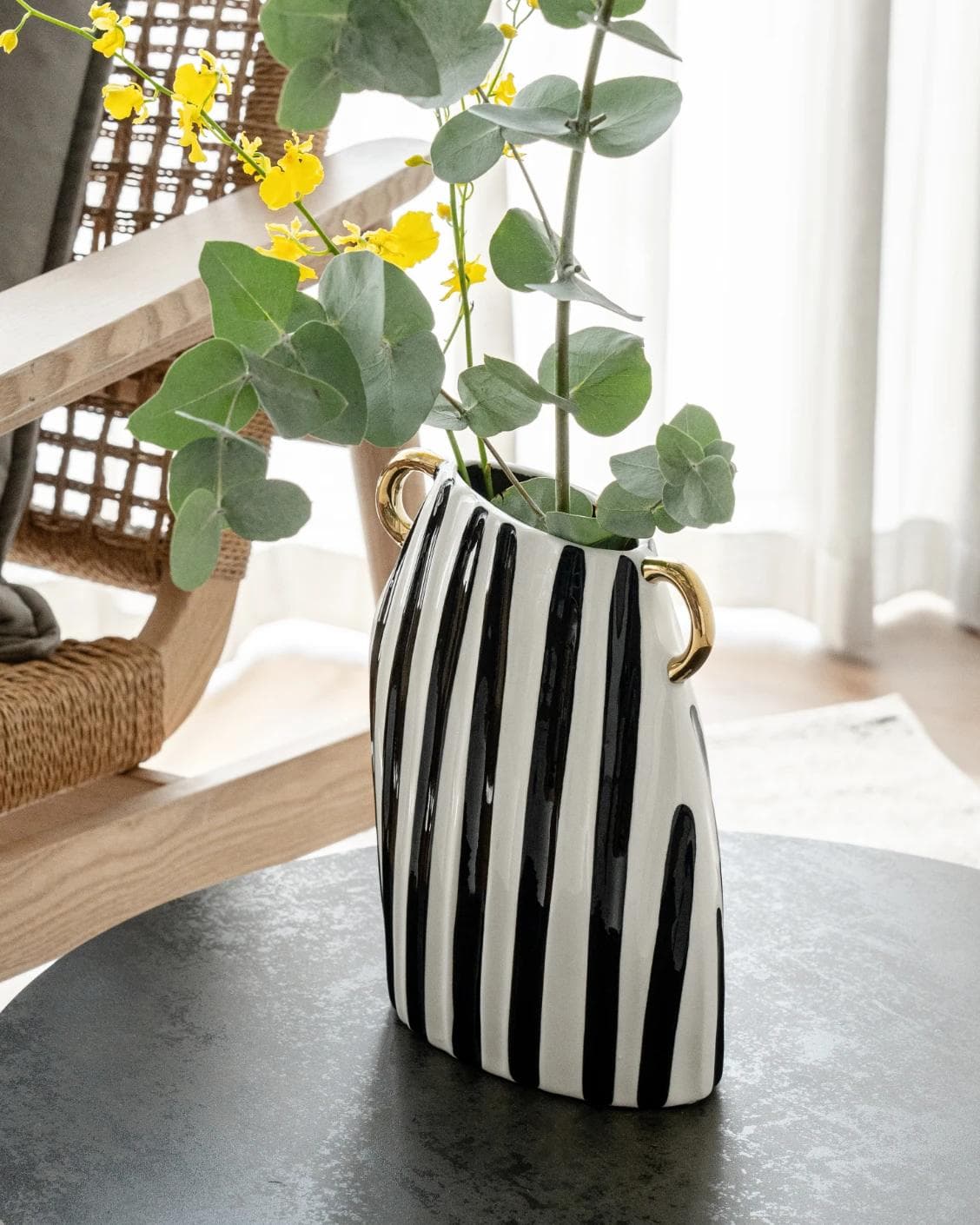 Yara Arneson vases in gold, black and white, shown in a lifestyle right view as image 6