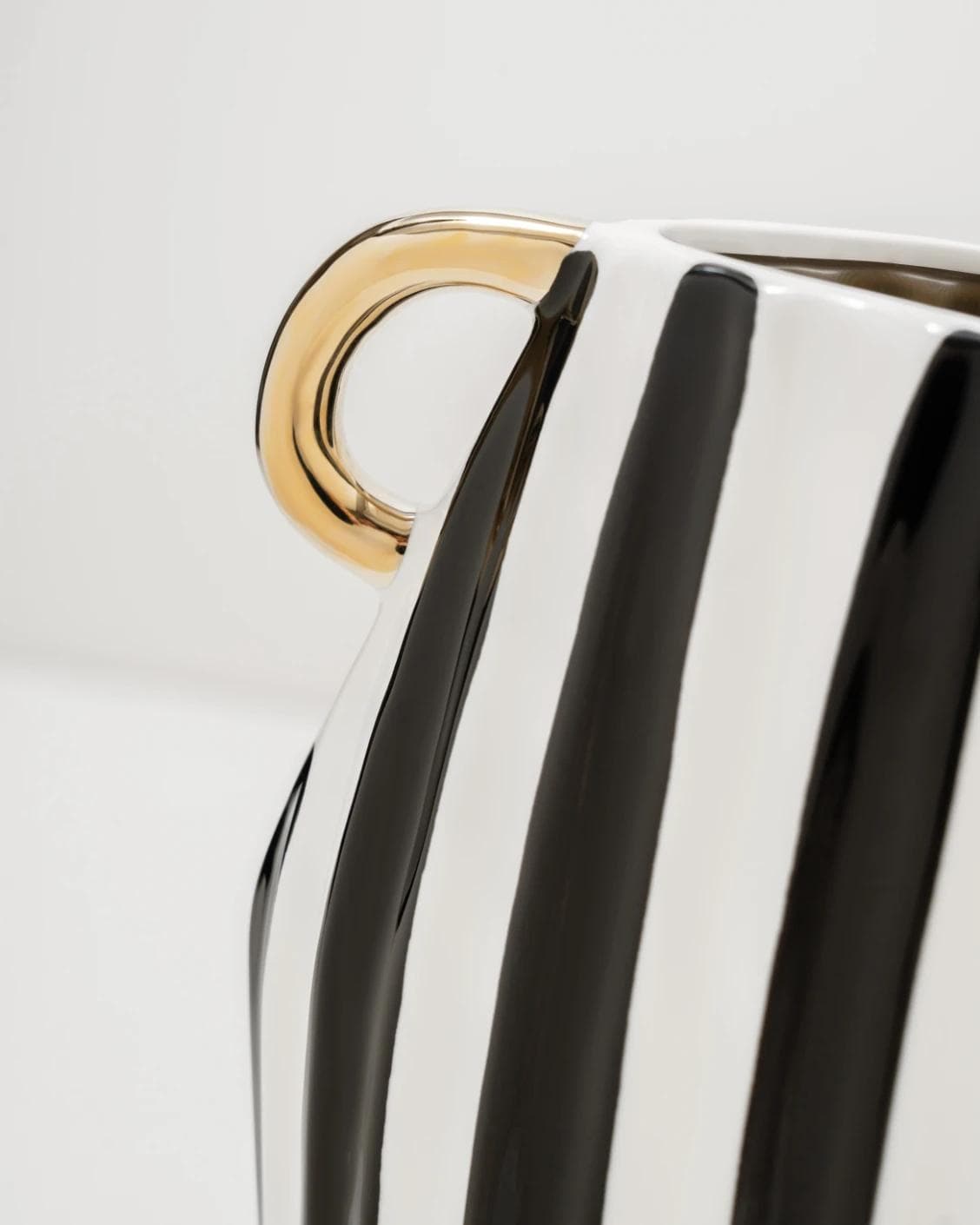 Yara Arneson vases in gold, black and white, shown in a product close-up as image 7