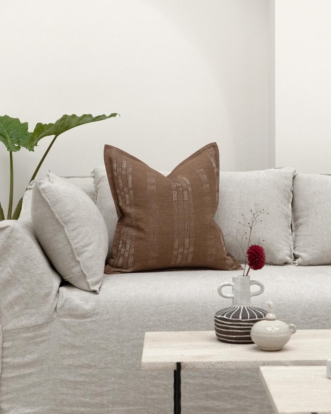 Yon Brick cushion in brown, shown in a lifestyle front view as image 4