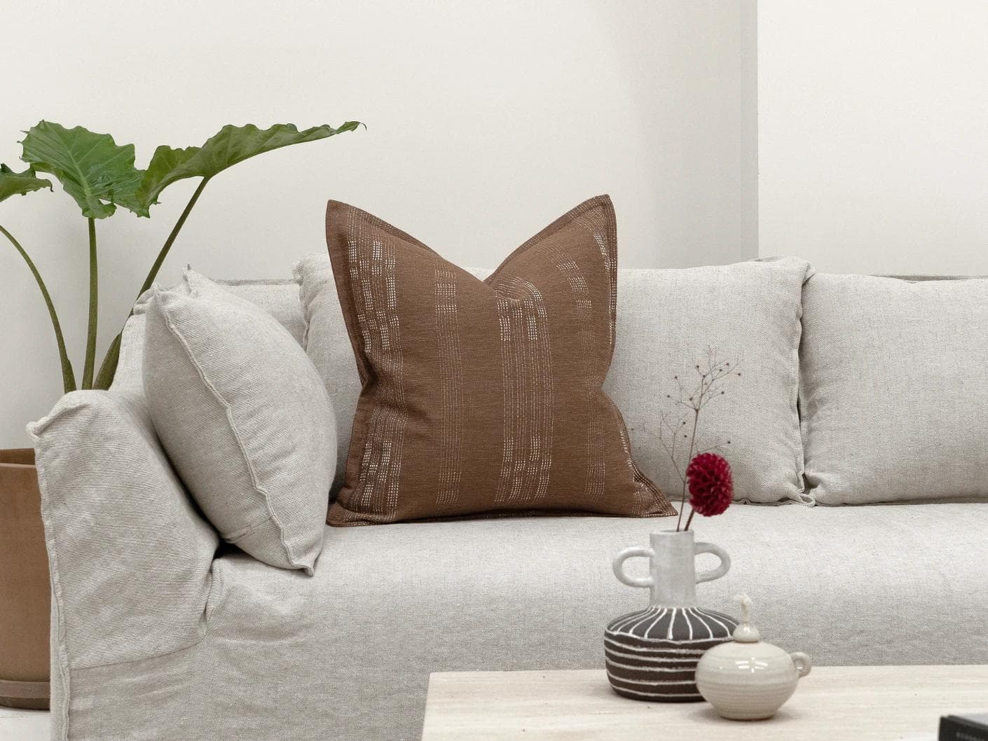 Yon Brick cushion in brown, shown in a lifestyle front view as image 4