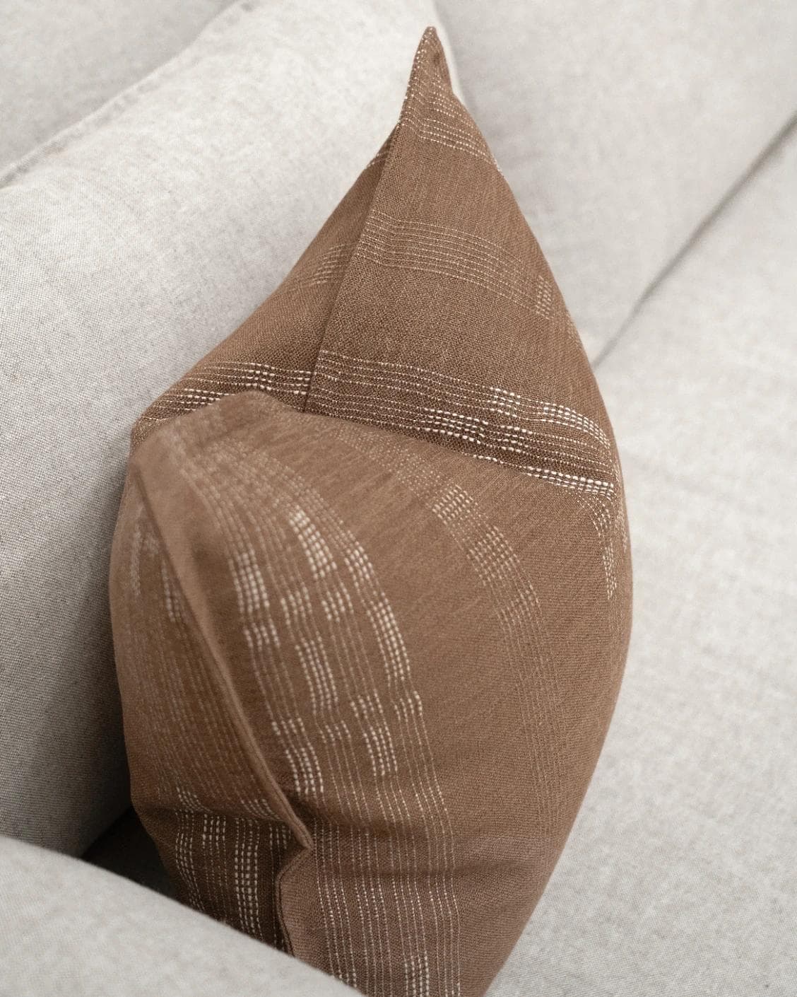 Yon Brick cushion in brown, shown in a lifestyle top view as image 5