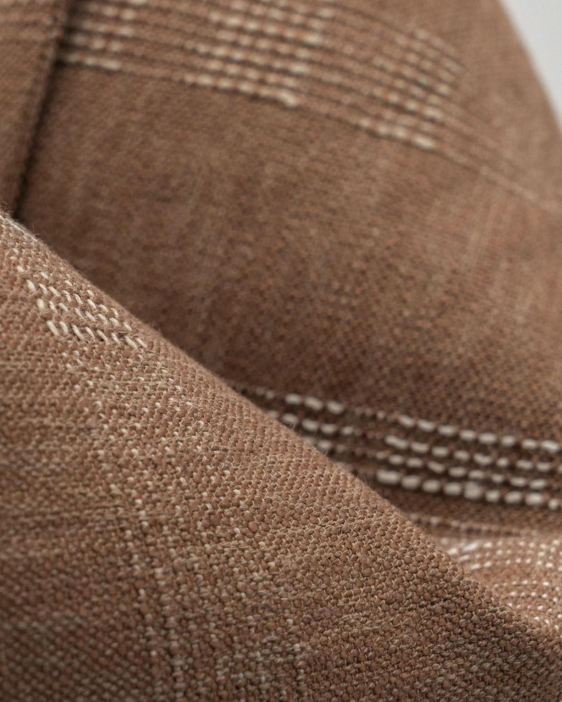 Yon Brick cushion in brown, shown in a product close-up as image 8