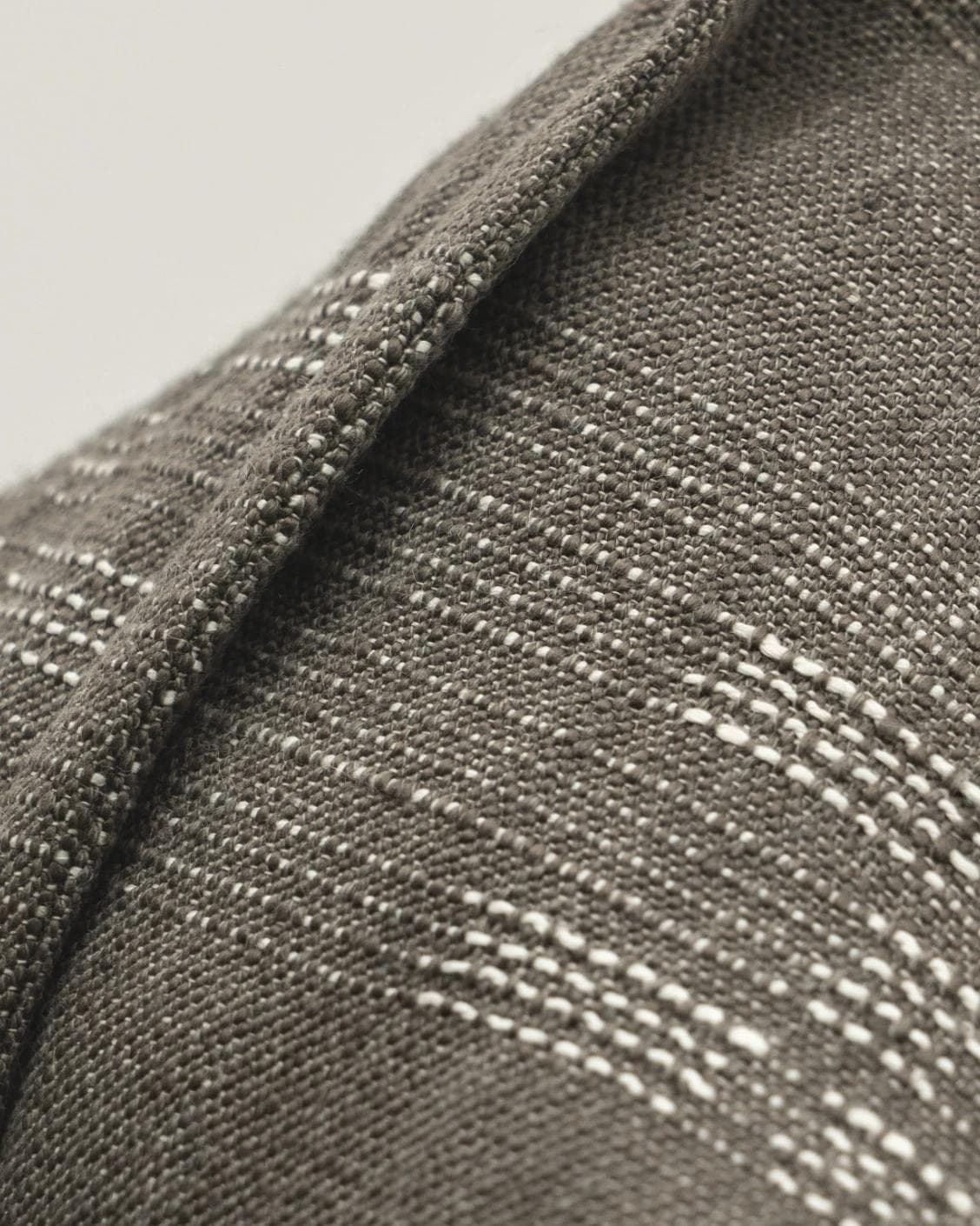 Yon Laurent cushion in taupe and charcoal, shown in a product close-up as image 7