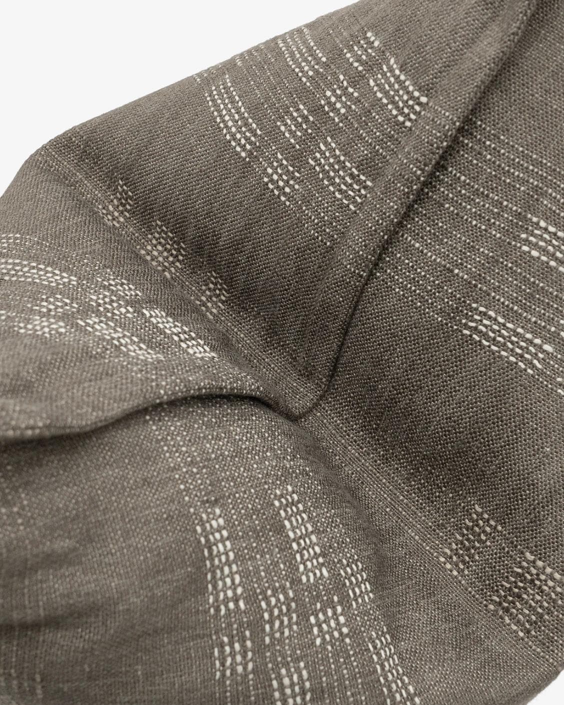 Yon Laurent cushion in taupe and charcoal, shown in a product top view as image 10