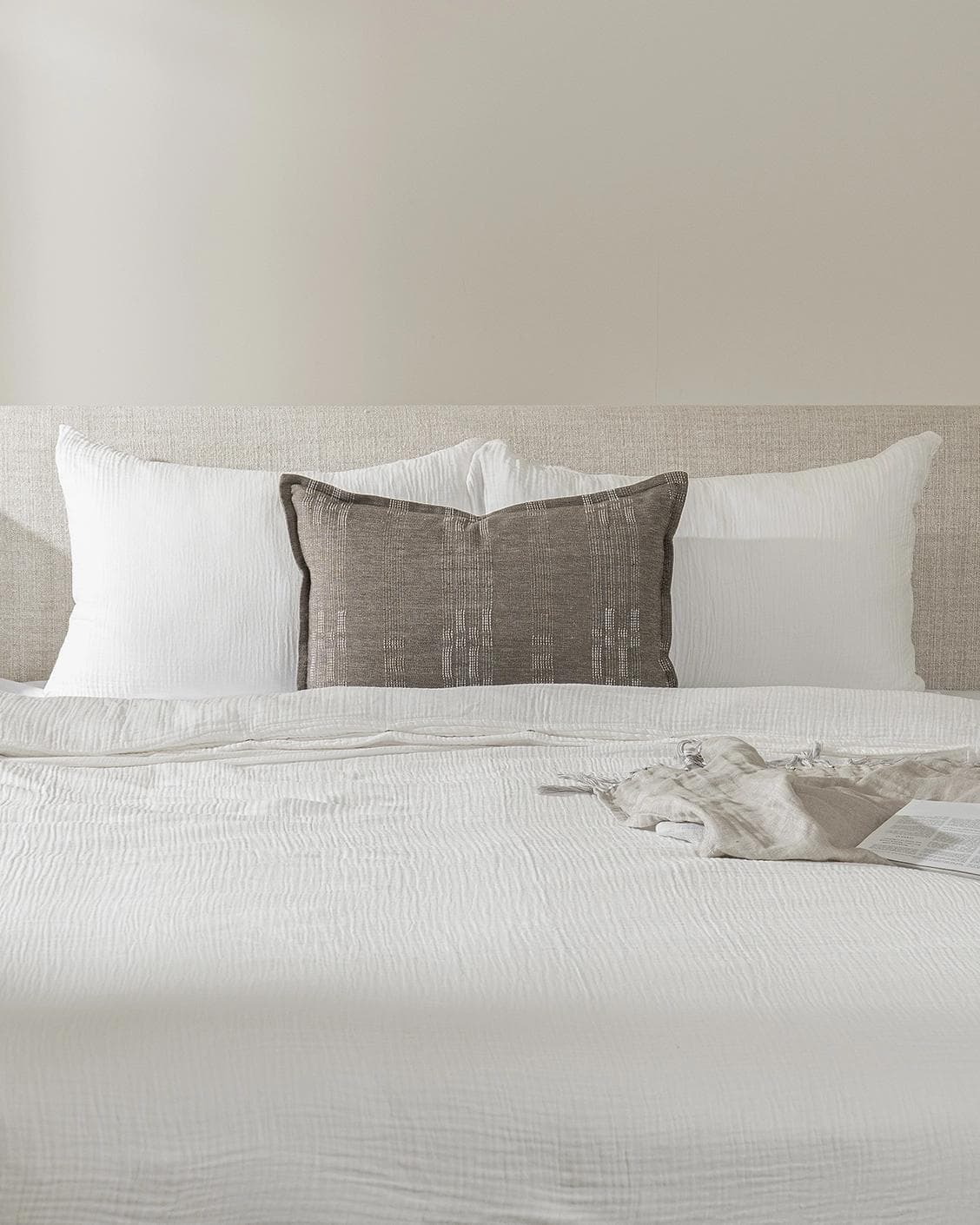 Yon Laurent III cushion, shown in a lifestyle front view as image 2