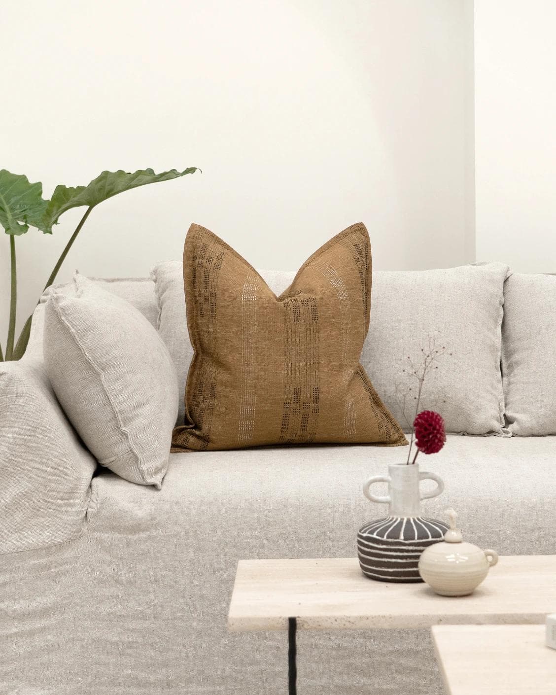 Yon Ochre cushion in ochre brown, shown in a lifestyle front view as image 4